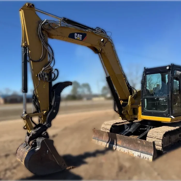2018 Caterpillar 308E2 CR mini excavator with compact radius, swing boom, and high-definition hydraulic system for confined space construction and trenching.
