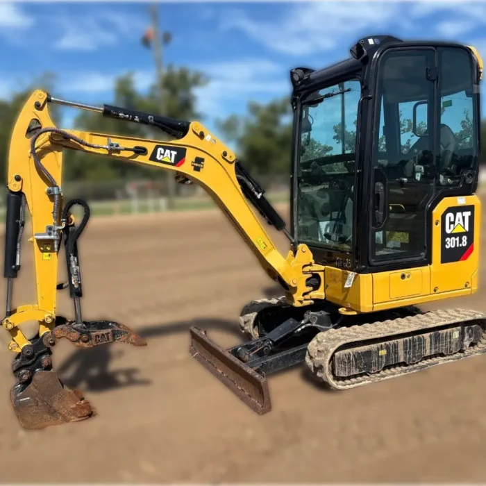 2020 Caterpillar 301.8 mini excavator with expandable undercarriage, stick steer travel mode, and tilt-up canopy for easy maintenance in tight construction spaces.