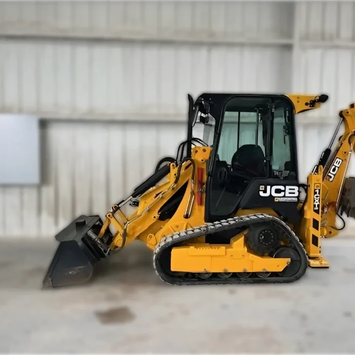 2022 JCB 1CXT tracked backhoe loader with compact design, skid steer maneuverability, and powerful Perkins engine for versatile excavation and loading in confined spaces.